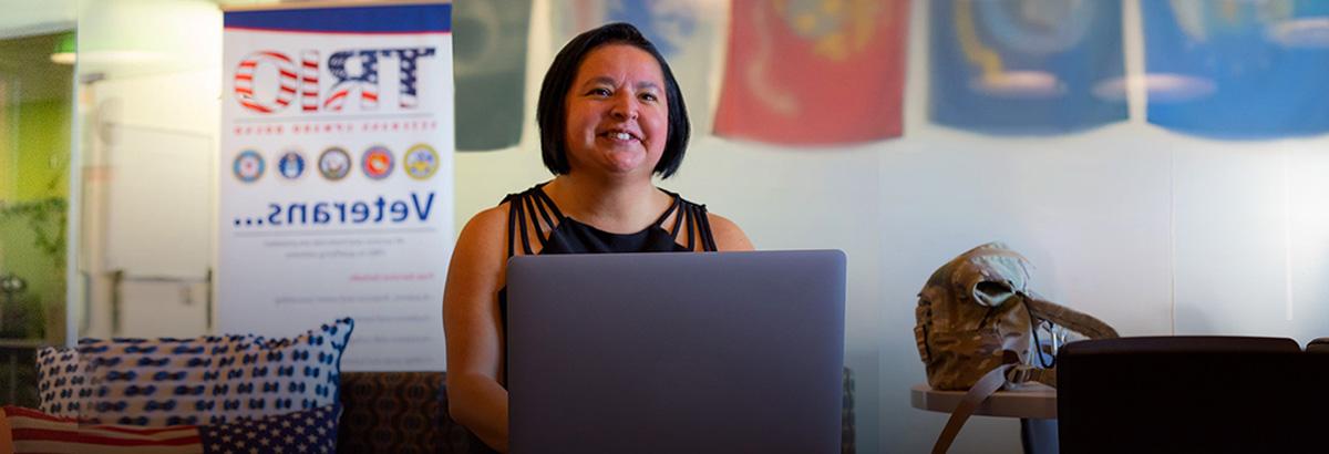 安吉Buenrostro sits smiling in the veterans center at Northwest Campus